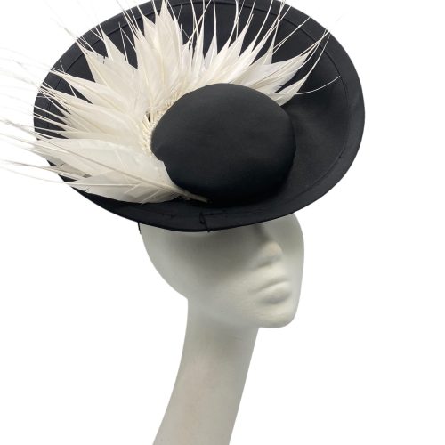 Black satin front sitting disc with a fan of beautiful white feathers.
